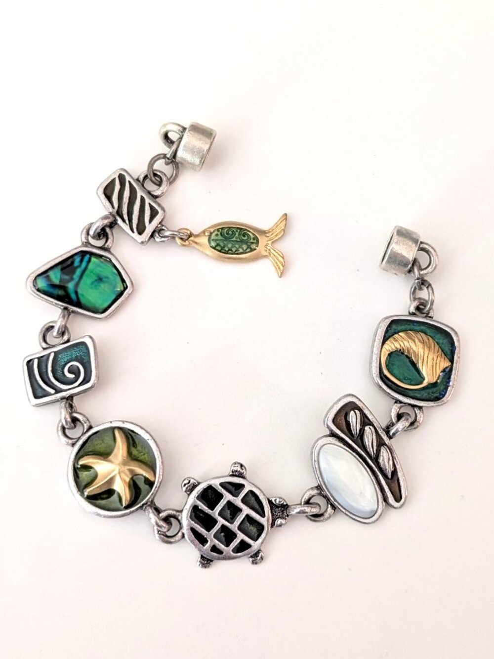 Ocean themed silver bracelet with silver, gold and enamel